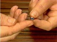 Hands holding the setting
